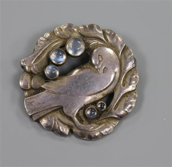 A Georg Jensen sterling silver and cabochon moonstone set dove brooch, no. 123, import marks for 1980, 44mm.